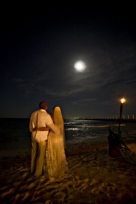 Beach couple under full moon